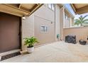 Inviting entryway with a potted plant near the front door, and covered walkway at 8013 Peach Dr, Temple Terrace, FL 33637