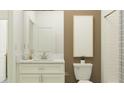 Clean bathroom with white vanity, brown accent wall, and a tiled shower at 9760 Minnow Ray Dr, Land O Lakes, FL 34638