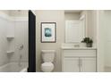 Clean and modern bathroom with a tub shower combo and vanity at 12730 Crystal Jade Way, Parrish, FL 34219