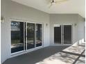 Covered patio with sliding glass doors and ceiling fan at 13184 73Rd Ave, Seminole, FL 33776