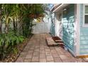 Side patio with walkway and access to the house at 13405 Gulf Blvd, Madeira Beach, FL 33708