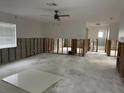 Spacious living room with exposed walls and ceiling at 1798 Shore Acres Ne Blvd, St Petersburg, FL 33703