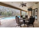 Covered patio area overlooking the refreshing pool at 19116 Sweet Clover Ln, Tampa, FL 33647