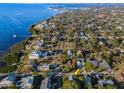 Gorgeous aerial view of the community, home, and waterfront; a truly remarkable property at 523 Georgia Ave, Crystal Beach, FL 34681