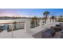 Relaxing balcony overlooking the water with outdoor seating at 7810 10Th S Ave, St Petersburg, FL 33707