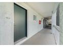 Condo hallway with unit 217, leading to outdoor view at 801 83Rd N Ave # 217, St Petersburg, FL 33702