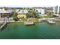 Aerial view of waterfront property with a dock and swimming pool at 9715 Harrell Ave # 25, Treasure Island, FL 33706