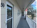 Condo hallway with light walls and a balcony at 2263 Americus E Blvd # 59, Clearwater, FL 33763