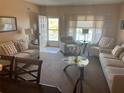 Spacious living room with comfy sofas and a coffee table at 2263 Americus E Blvd # 59, Clearwater, FL 33763