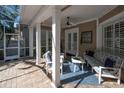 Relaxing back patio with seating area and ceiling fan at 404 Manns Harbor Dr, Apollo Beach, FL 33572