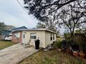 House exterior showcasing a side view and landscaping at 4865 163Rd N Ave, Clearwater, FL 33762