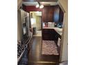 Kitchen with stainless steel appliances and dark wood cabinets at 5266 6Th S Ave, St Petersburg, FL 33707