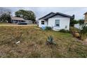 Front view of a cozy house with a yard at 6502 S Himes Ave, Tampa, FL 33611