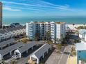 Aerial view of beachfront condo building with parking and ocean views at 17980 Gulf Blvd # 403, Redington Shores, FL 33708