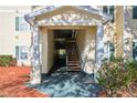 Apartment building entrance with stairs leading to upper levels at 18327 Bridle Club Dr # 18327, Tampa, FL 33647