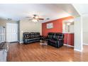 Living room features hardwood floors and neutral wall colors at 18840 Parapet Pl, Land O Lakes, FL 34638