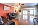 Spacious living room with hardwood floors and comfortable seating at 18840 Parapet Pl, Land O Lakes, FL 34638