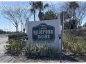 Hillcrest Villas deed restricted community sign with lush landscaping at 24862 Us Highway 19 N # 1602, Clearwater, FL 33763