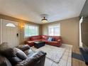 Living room with leather sofas and a large TV at 2526 44Th S St, St Petersburg, FL 33711