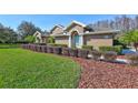 House exterior showcasing walkway and landscaping at 2659 Keystone Springs Rd, Tarpon Springs, FL 34688