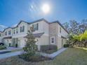 Townhome with landscaping and a sidewalk at 30822 Veridian Way, Wesley Chapel, FL 33543