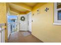 Inviting condo entry with private balcony at 370 8Th N Ave # 7, Tierra Verde, FL 33715