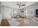 Bright living room with hardwood floors and cozy seating at 370 8Th N Ave # 7, Tierra Verde, FL 33715