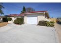 White garage door and driveway of the house at 6911 El Camino Paloma St, Port Richey, FL 34668