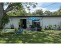 Spacious backyard with patio furniture and lush green grass at 5601 9Th N Ave, St Petersburg, FL 33710