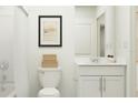 Modern bathroom with white vanity, toilet, and shower/tub combo at 10236 Alder Green Dr, Riverview, FL 33578