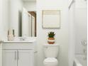 Clean bathroom featuring white vanity, toilet, and bathtub at 10236 Alder Green Dr, Riverview, FL 33578