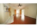 Living room featuring laminate wood floors at 12217 Peaceful Ave, Weeki Wachee, FL 34614