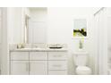 Bathroom with white cabinets and granite countertop at 13574 Newbridge St, Spring Hill, FL 34609