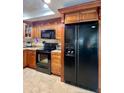 Spacious kitchen with granite countertops and dark wood cabinets at 14655 Pine Glen Cir, Lutz, FL 33559