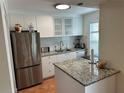 Modern kitchen with stainless steel appliances and granite countertops at 1799 N Highland Ave # 38, Clearwater, FL 33755