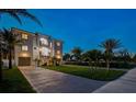 Luxury waterfront home with nighttime exterior lighting at 1964 Cedar Dr, Dunedin, FL 34698