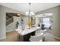 Bright dining room with chandelier and open floor plan at 20209 Merry Oak Ave, Tampa, FL 33647