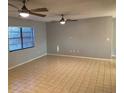 Living room with natural light, tile floors, ceiling fan, and neutral paint at 2134 Victory Ave, Largo, FL 33770