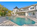 A luxurious pool with fountains and an elegant patio, perfect for outdoor entertaining at 2186 Coffee Pot Ne Blvd, St Petersburg, FL 33704