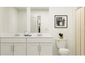 Double vanity, toilet, and shower in bathroom at 2645 Sunray Venus Way, Ruskin, FL 33570