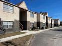 Street view of tan colored multi-unit building with brick at 9011 Westchester Cir # 24, Tampa, FL 33604