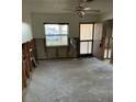 Spacious living room with a large window and open layout ready for renovation at 477 88Th N Ave, St Petersburg, FL 33702