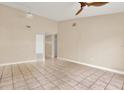 Bright living room with tile floors and ceiling fan at 11408 Midfield Way # 11408, Tampa, FL 33624