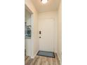 Bright entrance with a white front door and wood-look floors at 1303 S Hercules Ave # 1, Clearwater, FL 33764