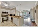 Modern kitchen with stainless steel appliances and granite countertops at 2722 Via Tivoli # 432B, Clearwater, FL 33764