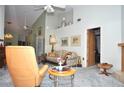 Relaxing living room with comfortable seating and warm, inviting decor at 5565 Salem Square N Dr, Palm Harbor, FL 34685