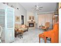 Spacious living room featuring a fireplace, comfy seating, and hardwood floors at 5565 Salem Square N Dr, Palm Harbor, FL 34685