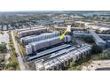 An aerial shot shows the well-maintained exterior of a multi-Gathering residential building with dedicated resident parking at 5623 80Th N St # 505, St Petersburg, FL 33709