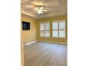 Bright bedroom with hardwood floors and plantation shutters at 6035 Plover Meadow St, Lithia, FL 33547