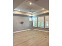 Spacious living room featuring hardwood floors and plantation shutters at 6035 Plover Meadow St, Lithia, FL 33547